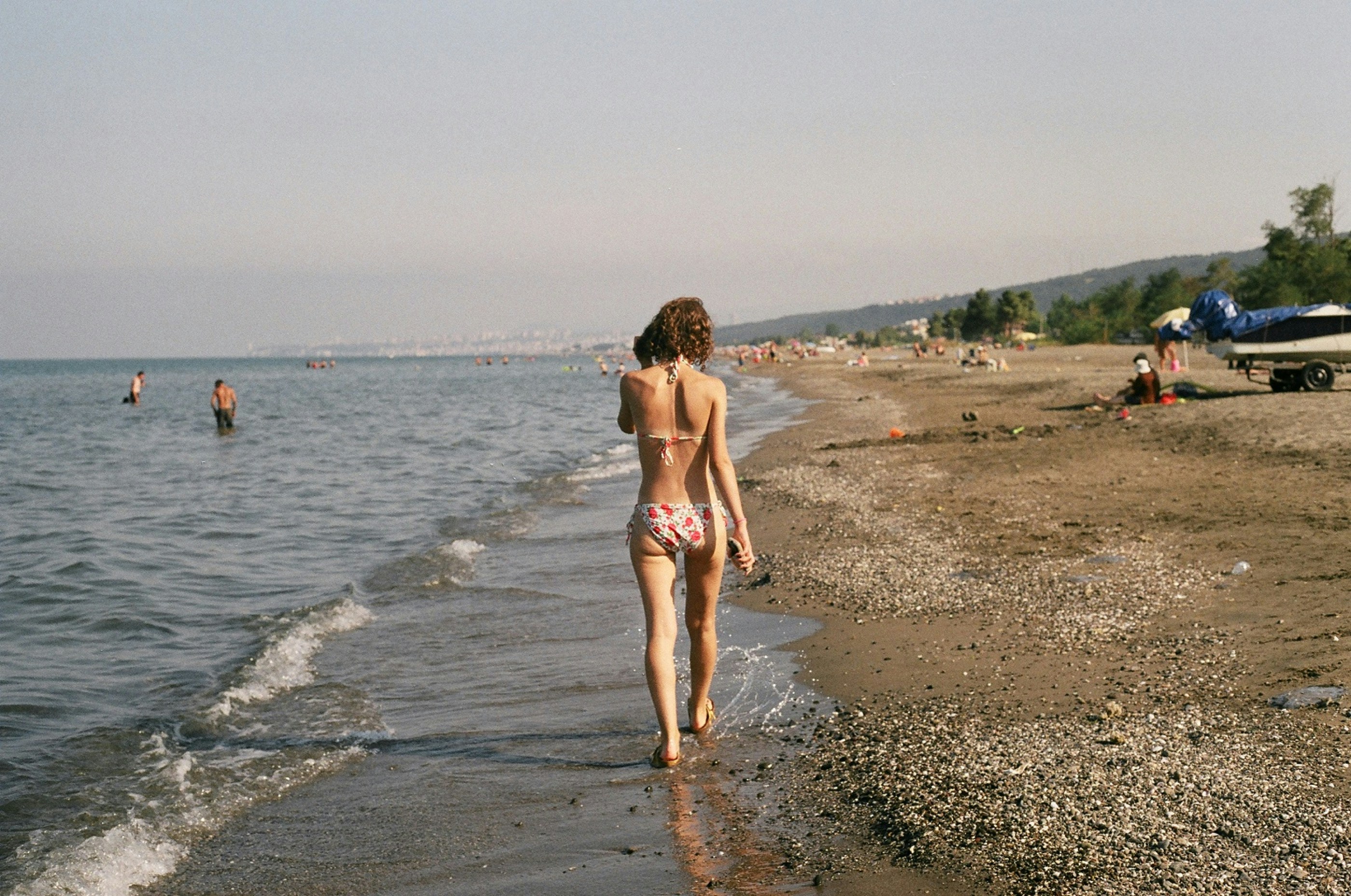 Woman overlooking Miyako-jima emerald lagoon Japan